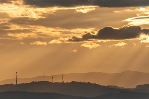 Wind turbines on the mountains of the Black Forest at dawn. Freiburg brisgau