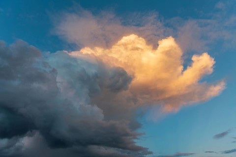Sky of pink and orange clouds in the evening at sunset. Alsace