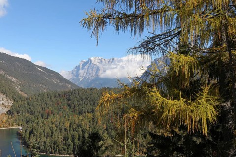 View of the Zugspitze massif with Blindsee lake in autumn