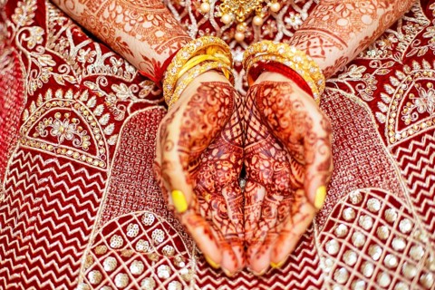 Traditional bridal jewelry and henna decoration on the hands of Hindu bride on her wedding day