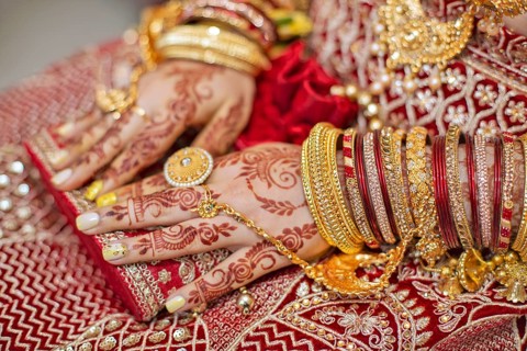 Traditional bridal jewelry and henna decoration on the hands of Hindu bride on her wedding day