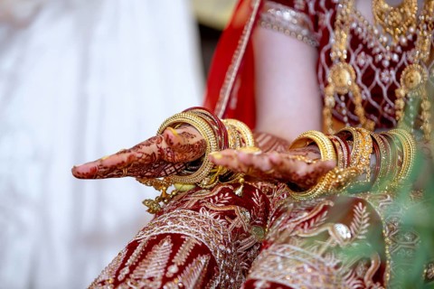 Traditional bridal jewelry and henna decoration on the hands of Hindu bride on her wedding day
