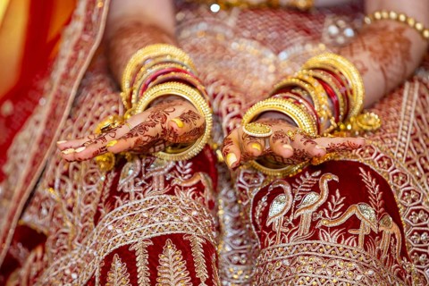 Traditional bridal jewelry and henna decoration on the hands of Hindu bride on her wedding day