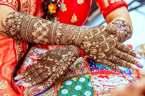 Beautiful henna design on the hand of a Hindu bride on her wedding eve