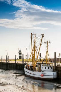 Black and white lighthouse and crab cutter