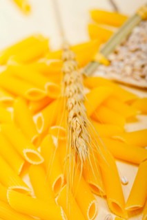 Short Italian pasta penne with durum wheat grains