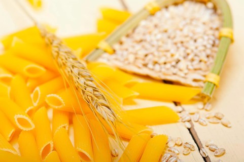 Short Italian pasta penne with durum wheat grains