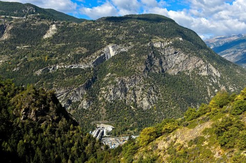 Construction site of the A9 motorway for the Visp tunnel in a deep valley of the Valais Alps