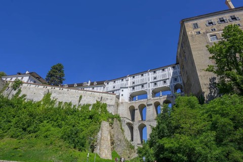 View up to the castle with historical bridge Plastovy most