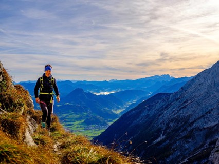 Mountaineer walking on a narrow path above the Salzach valley