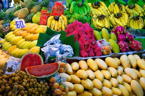 Typical stalls with huge selection of fresh fruits and vegetables at Banzaan fresh market