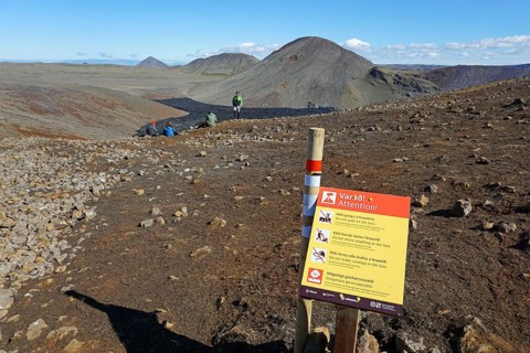 Warning sign near lava field