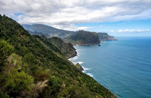 View of steep rocky coast and sea