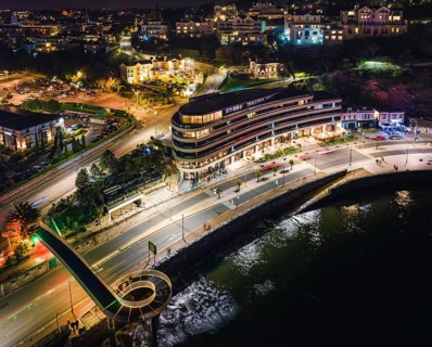 Night over Torbay Road and Torre Abbey Sands from a drone