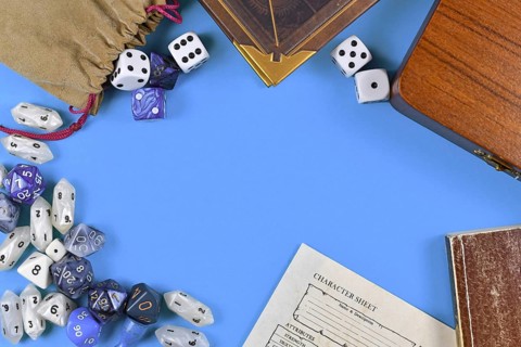 Flat lay concept design for tabletop role playing with blue and white RPG dices