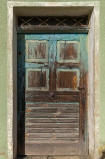 Old front door of a vacant farmhouse