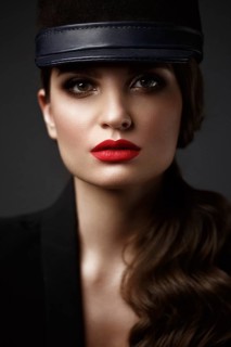 Beautiful sexy woman in a fashionable hat