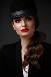 Beautiful sexy woman in a fashionable hat