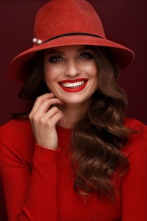 Beautiful sexy woman in a fashionable hat