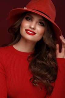 Beautiful sexy woman in a fashionable hat