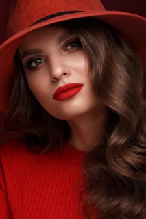 Beautiful sexy woman in a fashionable hat