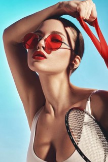 Beautiful attractive woman in a trendy swimsuit with sports equipment and accessories. Fashion photo session. beauty face