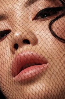 Portrait of beautiful asian woman with mesh on face and makeup. Beauty face. Close-up