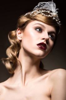 Portrait of elegant retro woman with beautiful hair and dark lips. Beauty face. Picture taken in the studio