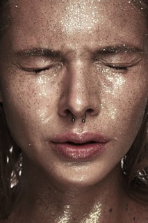 Portrait of a girl with emotion on her face. Photo taken in studio