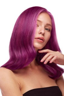 Beautiful girl with multi-colored hair and classic make-up and hairstyle. Beauty face. Photo taken in the studio