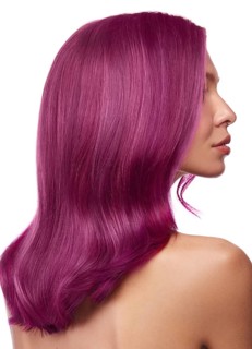 Beautiful girl with multi-colored hair and classic make-up and hairstyle. Beauty face. Photo taken in the studio