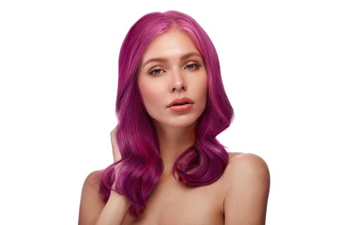 Beautiful girl with multi-colored hair and classic make-up and hairstyle. Beauty face. Photo taken in the studio