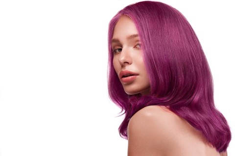 Beautiful girl with multi-colored hair and classic make-up and hairstyle. Beauty face. Photo taken in the studio