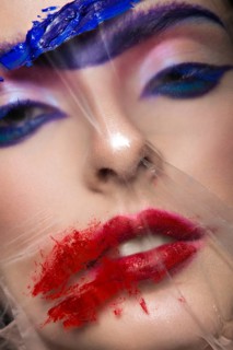 Fashion model with bright make-up art with a solid eyebrow. Creative image. Picture taken in the studio