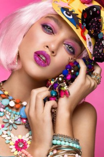Funny comic girl with bright make-up in the style of pop art. Creative image. Beauty face. Photo taken in the studio