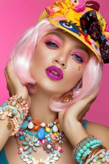 Funny comic girl with bright make-up in the style of pop art. Creative image. Beauty face. Photo taken in the studio
