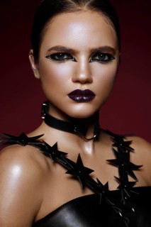 Beautiful girl with bright creative make-up and graphic arrows. Beauty face. Photos shot in studio