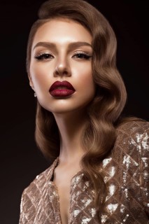 Beautiful girl in Hollywood image with wave and classic makeup. Beauty face. Photo taken in the studio