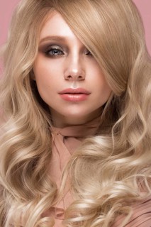 Beautiful blond girl with curls hair