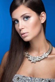 Beautiful woman with evening make-up and long straight hair