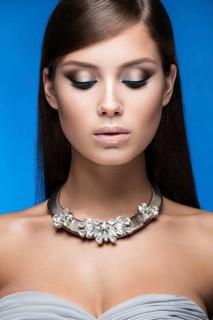 Beautiful woman with evening make-up and long straight hair