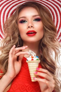 Bright cheerful girl in a summer hat