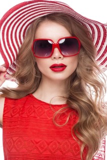 Bright cheerful girl in a summer hat