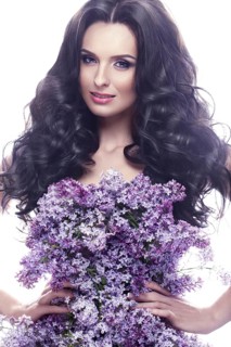Beautiful brunette girl with a gentle romantic make-up