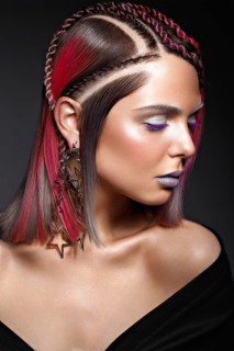 Beautiful girl with multi-colored hair and creative make-up and hairstyle. Beauty face. Photo taken in the studio