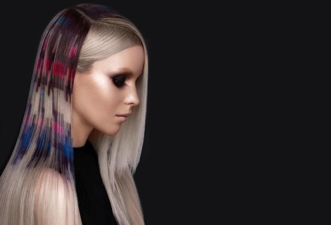 Portrait of beautiful woman with multi-colored hair and creative make up and hairstyle