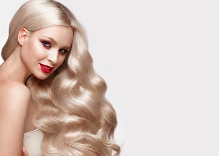 Beautiful blonde in a Hollywood manner with curls
