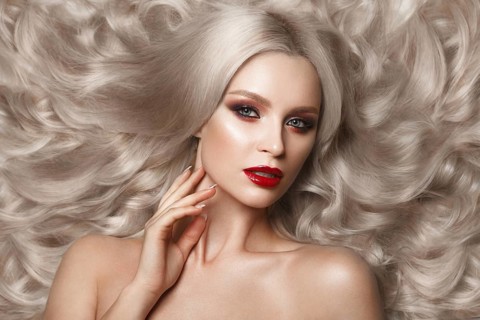 Beautiful blonde in a Hollywood manner with curls