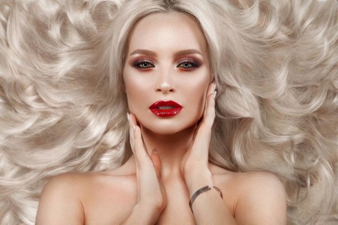 Beautiful blonde in a Hollywood manner with curls