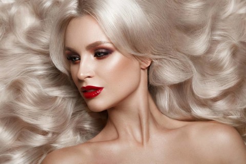 Beautiful blonde in a Hollywood manner with curls